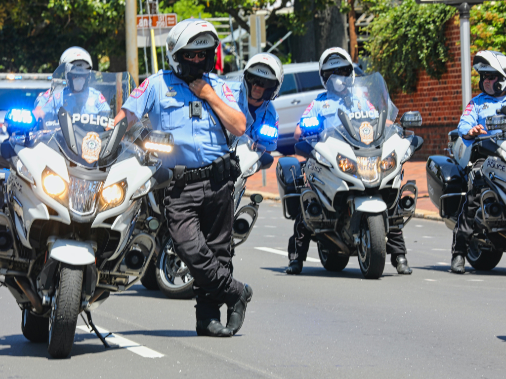 Police officers stopped on motorbikes